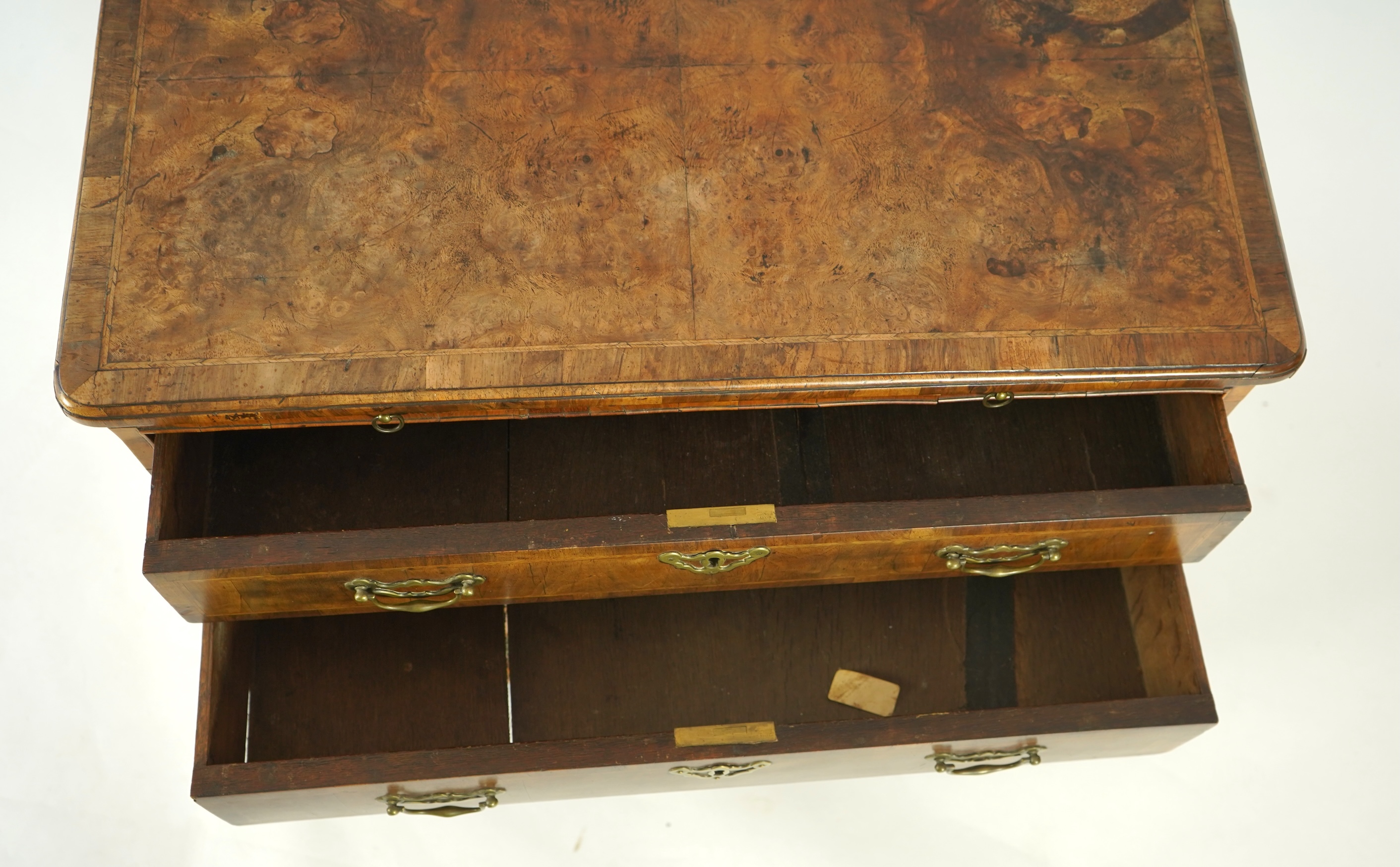 A small George I feather banded walnut chest